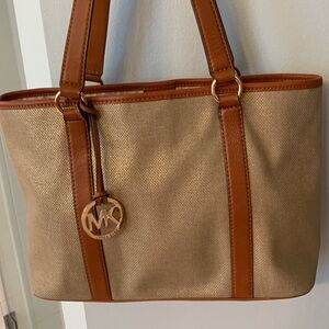 Michael Kors Gold/Beige Metallic Canvas Tote with luggage handles.